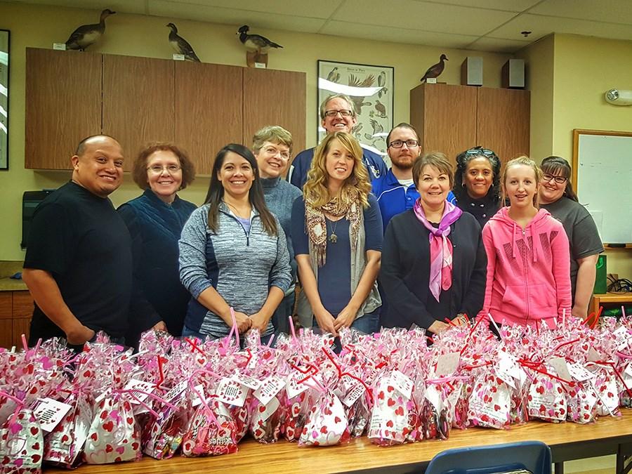 Academy of Applied Technology in Greeley. Working assembly-linestyle, members filled and packaged over 100 bags of sweet treats.