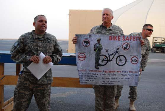 B 935th Aviation Support Battalion News Safety Day BBQ and Shop Wars Pictured above (L to R): CW2 John Boeh conducts a bike safety class as 935th ASB
