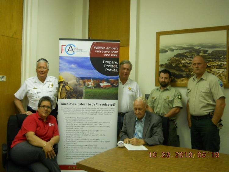 Towns County Commissioner signs Firewise Communities