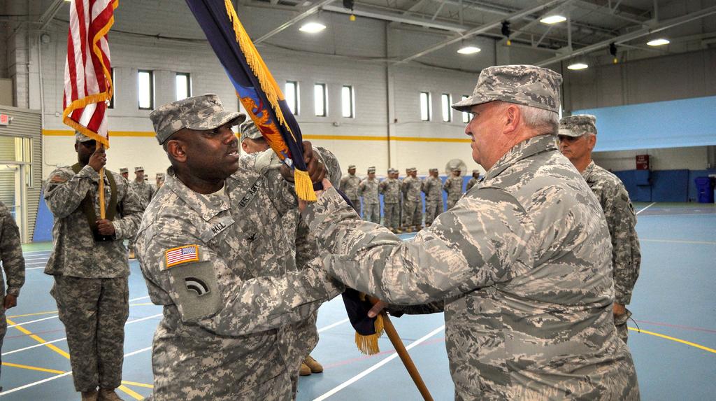 Around the State 57th gets new commander Col. Walter R. Nall, left, receives the 57th Troop Command colors from Brig. Gen. Michael L.