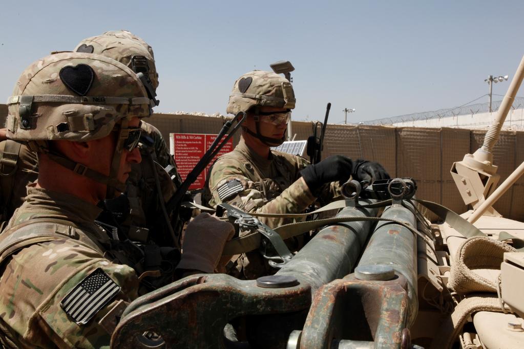 U.S. Army soldiers with Red Platoon, Apache Troop, 1/75th Cavalry Battalion, 2nd Brigade, 101st Airborne Division (Air Assault), tie down a tow bar