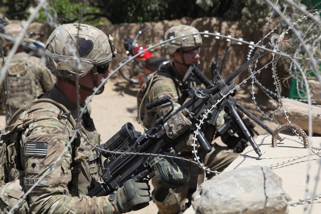 U.S. soldiers with Red Platoon, Apache Troop, 1/75th Cavalry Battalion, 2nd Brigade, 101st Airborne Division (Air Assault), provide security during a