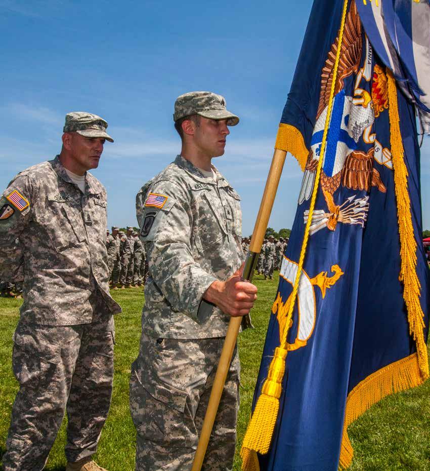 June 20, 2014 Godspeed, 1-114th Command Sgt. Maj. Thomas J. Clark, left, and guidon bearer Sgt. Adam E.