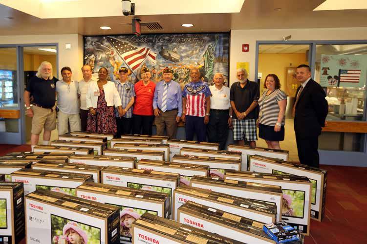 Westhoven/Released) Members of the Cairola-Barber Post 2342, Fort Lee Veterans of Foreign Wars, donate 30 flat screen televisions to the New Jersey Veterans Memorial Home