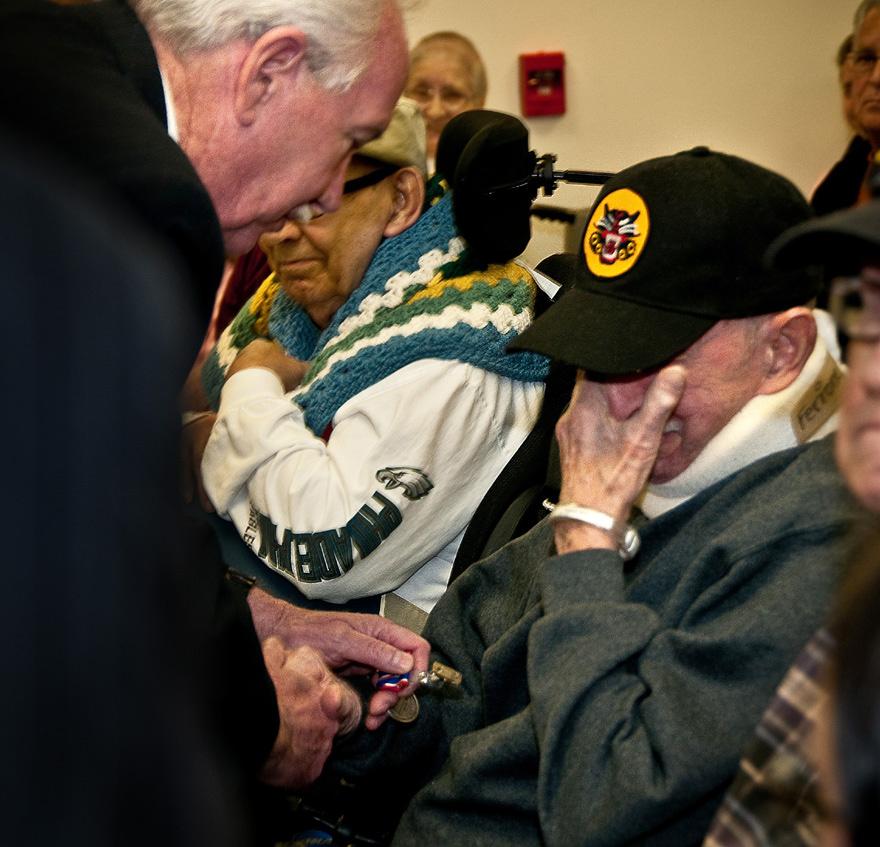 Right, Vito Ferrone, a World War II Army veteran, becomes emotional as he receives the NJ DSM from Zawacki. Below, the New Jersey Distinguished Service Medal. (Photos by Staff Sgt.
