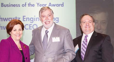 Small Business of the Year Christine Quinn and Joe Kirk present the award to